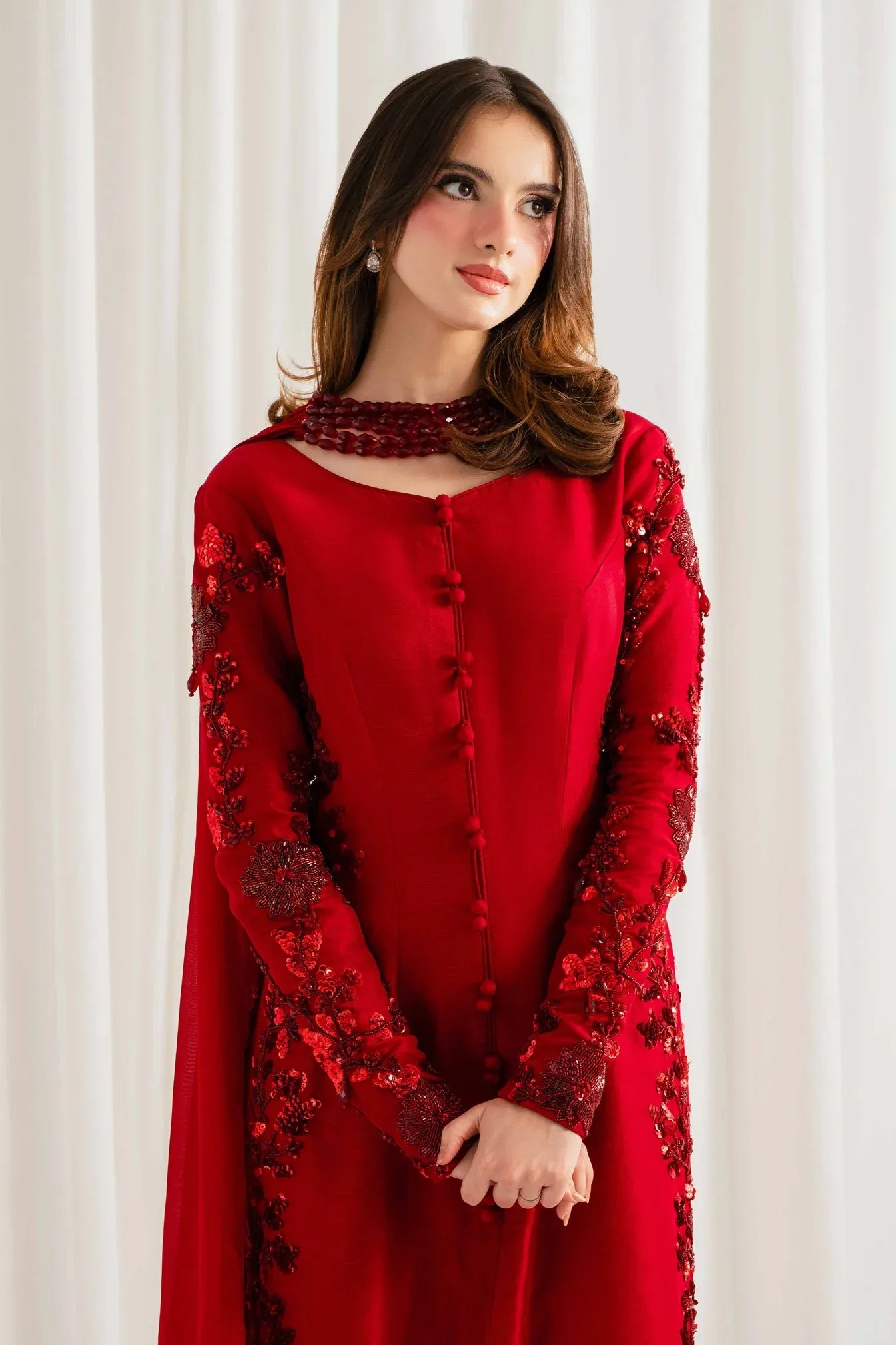 Rungish red kurta with beaded choker neckline and covered button placket – close-up